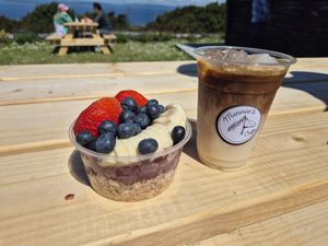 Vegan acai bowl and ice coffee with oatmilk. Very tasty :) at Minnie's Café in Inishmor