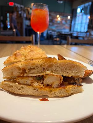 Vegan Cauliflower Parmesan sandwich. This is the chicken parm sandwich veganized; sub in crispy cauliflower patty and vegan cheese 👏🏼  at Wheat Penny Oven and Bar in Dayton