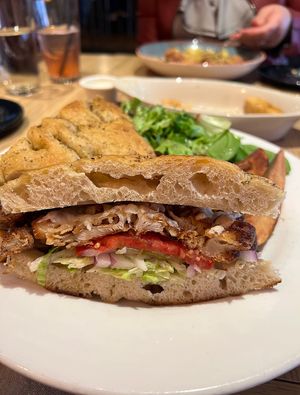 The Wheat Penny ‘Burger’, made vegan. Crispy cauliflower patty 🤤 on focaccia bread, with melty vegan cheddar, lettuce, onion tomato and pickles. So good and filling!  at Wheat Penny Oven and Bar in Dayton