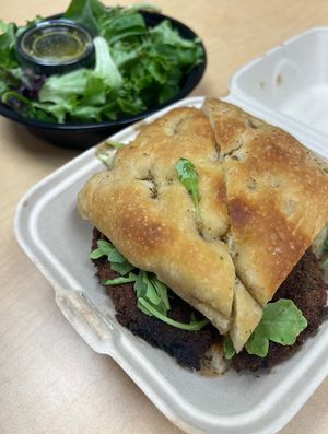 Mushroom Milanese sandwich with a side saladd  at Wheat Penny Oven and Bar in Dayton