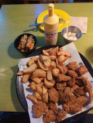 Vegan chicken, fries, rice cakes, and picked radish. at Chicken in the Kitchen in Seoul