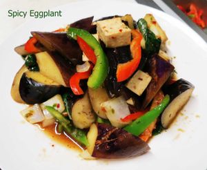 Spicy Eggplant : Flashed fried eggplant sautéed with chili paste, onion fried tofu, garlic, sweet basil, and bell pepper at Veggie House in Los Angeles