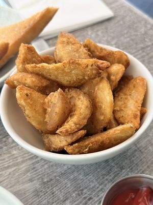 Fried potato wedges   at Paulina Escanes in San Juan
