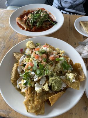 Lasagna (back) came with delicious rosemary sourdough and the chilaquiles (front) were so delicious!!!  at Sage Bistro - Cloud Kitchen in Culver City