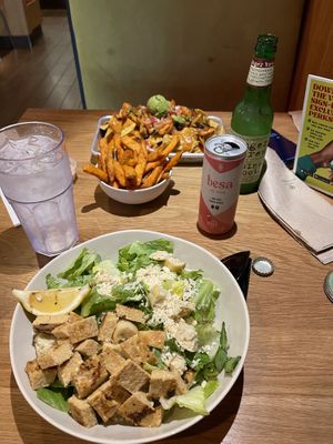 Caesar salad with tempeh, sweet potato fries, chikin tinga nachos  at Veggie Grill by Next Level - Downtown in Seattle