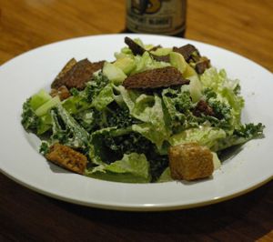 Kale caesar salad with tempeh bacon. at Veggie Grill by Next Level - Downtown in Seattle