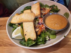 Sesame Tofu Supergreens Salad at Veggie Grill by Next Level - Downtown in Seattle