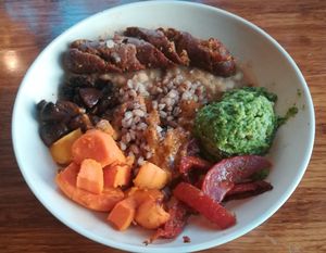 Rustic farm bowl + apple sage sausage at Veggie Grill by Next Level - Downtown in Seattle