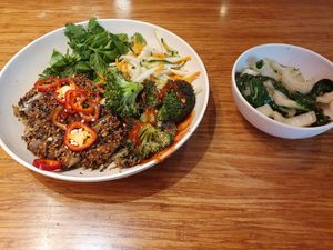 Far east bowl with ginger pak choy on a side at Veggie Grill by Next Level - Downtown in Seattle