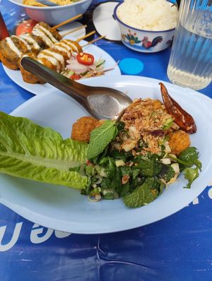 Foreground: vegan chicken popcorn. Background: tofu skewers at muan in South West London