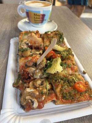 They cut the pizza (paid by weight) in little squares 🥲 pesto pizza + mushroom pizzaa  at La Fermata de Sarrià in Barcelona