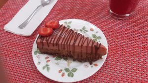 Raw vegan cheesecake with chocolate base and strawberry at Raw Cafe in Lima