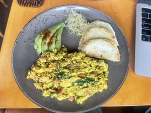 Tofu scramble with corn cakes  at Raw Cafe in Lima