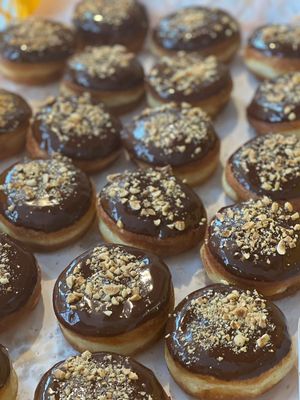 Vegan donuts with dark chocolate and nuts. at DAMKA • cafè & bakery in Krakow