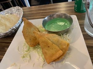 Samosa - Vegetarian triangle shaped puffs filled with potatoes and Indian spices. at Delhi Darbar Kitchen Singapore in East Singapore
