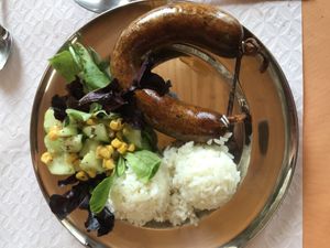 Vegan Portuguese-style sausage was good but I wish the rice had been doctored up a little more. Salad was okay but topped with canned veggies and was pretty small.  at O Oriente no Porto in Porto
