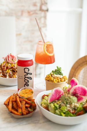 Butternut Nachos, Summer Corn Mac, Sweet Potato Fries, and Farmers Market Chopped Salad at chloe in New York City