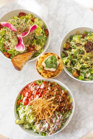 Farmers Market Chopped Salad, Summer Corn Mac, Kale Caesar Salad, and Quinoa Taco Salad at chloe in New York City