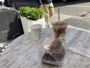 Chocolate espresso, cake, and vegan iced latte  at chloe in New York City