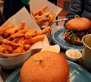 Portobello burguer, bbq burguer, skin-on chips and sweet-potato tempura at O Gambuzino Burger Clube in Lisbon