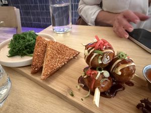 Wakame salad, sesame butternut squash toast, takoyaki bombs  at Ima in London