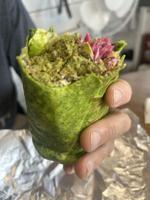 Falafel wrap.  Took some bites and caught up in the delicious flavours before we remembered to take a pic.   at Tastoria Kitchen - Food Stand in Oshawa
