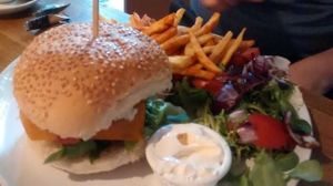 Smoked tofu and seitan burger with chips at Teatime Collective in Manchester