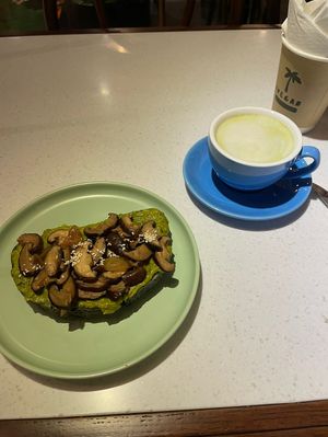 Avocado and mushroom toast and a matcha latte   at iVegan Supershop Nha Trang - Healthy Plant Based Cafe in Nha Trang