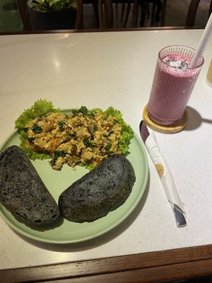 Scrambled tofu and toast with a pink dragon fruit smoothie   at iVegan Supershop Nha Trang - Healthy Plant Based Cafe in Nha Trang