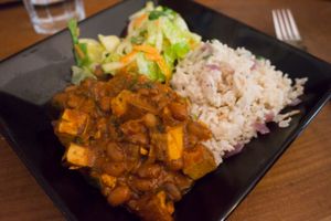 Smoked tofu and beans stew with rice and salad from the daily menu at Vegan Bar in Bratislava