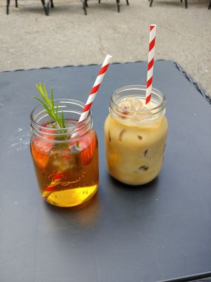 Apple juice (left) and iced coffee (right). The apple juice had two apple slices and a sprig of rosemary in it :) at Old School Cafe in Bury St Edmunds