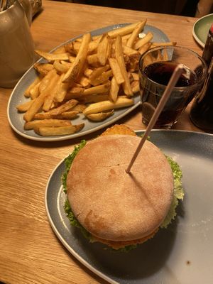 Vegan chi*ken burger with a side of fries (large)  at Hans im Glück in Berlin