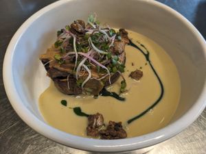 Nase Dengaku: japanese coinfit aubergine stuffed with smoked mushrooms and finished with edamame sauce, crunchy edamame and chinese rose sprouts (vegetarian) at Cochon&Carot in Hemiksem