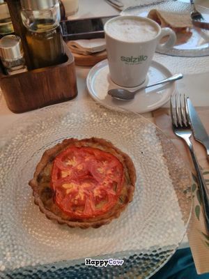 Quiche and coffee with almond milk at Biovegan Cafeteria Navarro in Valencia