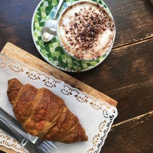 Croissant with a lot of blueberry jam and cappuccino with soy milk  at Biovegan Cafeteria Navarro in Valencia