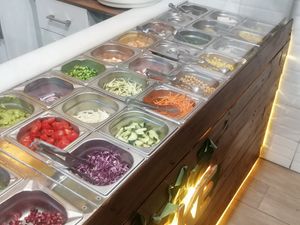 Range of options for the poke bowl, fresh and ready to serve at Lovely Poke in Milan