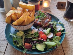 From the specials board during our visit; butternut squash and caramelised onion tart with salad and some seriously chunky chips as a side. Note the vegan sticker on plate. at The Raven Inn in Devizes