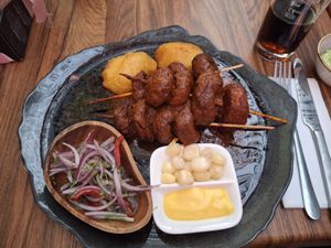 grilled mushrooms in savory sauce, peruvian corn and vegan mayo at Pachamama in Bremen