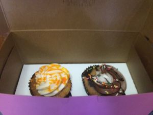 To-go cupcakes in pink boxes  at Get Caked Bakery in Rochester