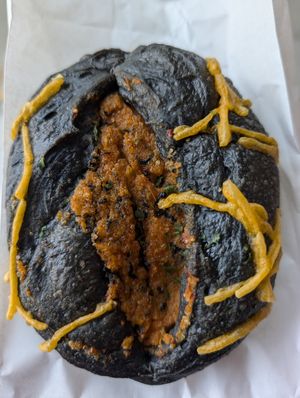 Charcoal bun with fishy filling at Wheat Allergy Baking Studio in Taichung