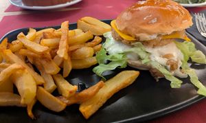 "chicken" burger with a pickle aioli and cheese. 
I did triple check that everything was vegan.  at Pa amb Tomàquet i in Calella