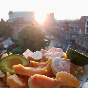 enjoying sunrise eating fruits at Himalayan Vegan Restaurant in Kathmandu