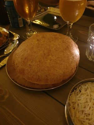 Mowgli Puri: Pillowy epic soft fried golden flat bread. The ultimate Indian celebration bread. at Mowgli in Knutsford