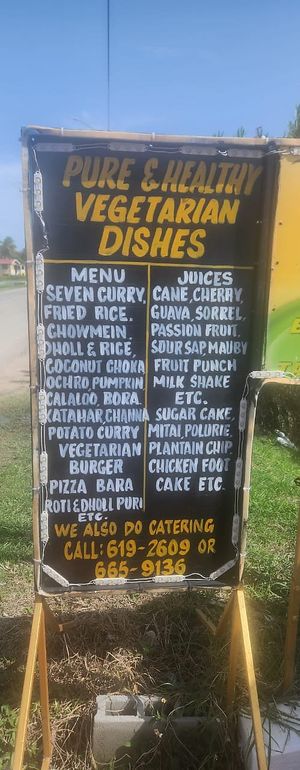 Sign outside showing menu at Veggie Castle in Reliance