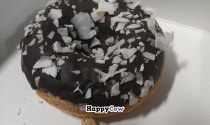 Vegan vanilla donut with chocolate icing and coconut at Check Out My Buns in Belfast