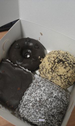 selection of vegan chocolate donuts and vegan tray bakes at Check Out My Buns in Belfast