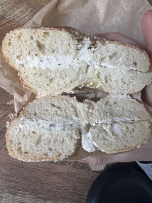 Sesame bagel with garlic and herb vegan shmear  at Backyard Bagel in Seattle