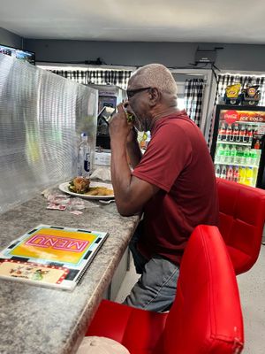 Mr Robert enjoying his BYO burger  at Feed Me in Amarillo