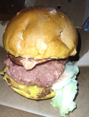 Vegan burger with vegan bacon and vegan burger sauce at Spino's in Lecce