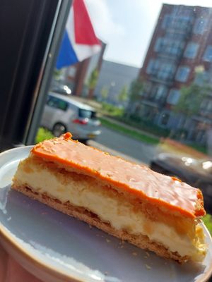 (orange) tompouce, during Kingsday in NL at Lente - Vegan Patisserie in Gouda